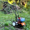 Equipo agrícola van Beek de 2.6 HP utilizado en terreno con pasto para labores de cultivo y jardinería.